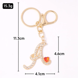 Luxury gold letter A keychain with sparkling crystals and a red heart charm ornament