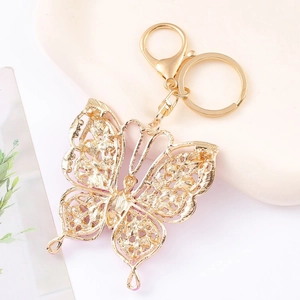 Exquisite hollow butterfly keychain in golden finish with sparkling rhinestone details