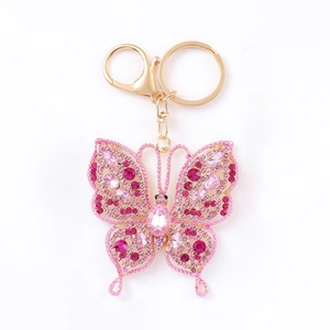 Elegant hollow butterfly keychain with pink crystals and gold-plated lobster clasp for bags