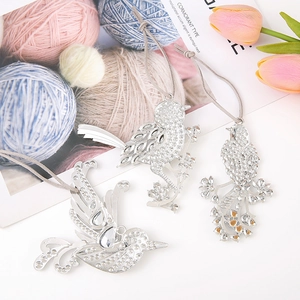Three silver zinc alloy bird ornaments with sparkling rhinestones and grey hanging cords