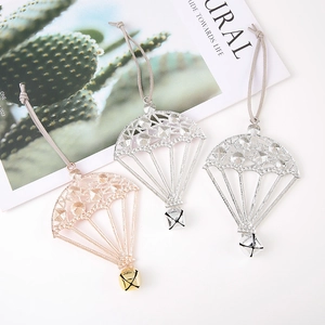 Christmas tree parachute pendants in rose gold and silver metal with bells and cords