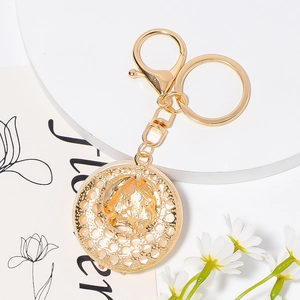 Exquisite gold hollow mesh horse head pendant keychain with shimmering metallic finish