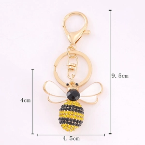 Golden rhinestone bee keychain with white enamel wings and 9.5cm total length