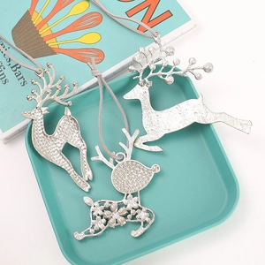 Three-piece silver reindeer pendant set with hollow floral design and matte finish