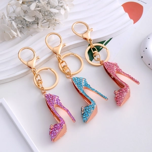 Sparkling rhinestone high heel keychains in purple blue and pink with gold metal clips