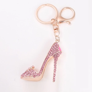 Elegant rose gold high heel keychain with sparkling pink rhinestones on a white background
