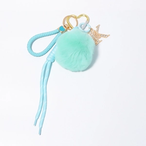 Chic keychain with mint faux fur pompom, woven leather strap and rhinestone letter K