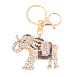 Golden elephant keychain with rhinestones and black enamel detail on white background