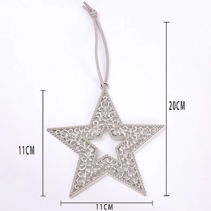 Detailed view of silver star ornament with hollow patterns and sparkling rhinestones