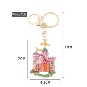 Pink enamel castle keychain with gold metal ring and rhinestones, 12cm total length