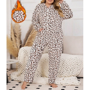Warm women's leopard print hooded onesie in thick fleece with zipper and cozy home styling
