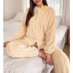 Thick beige coral fleece pajama set with cable knit texture and floral button detail