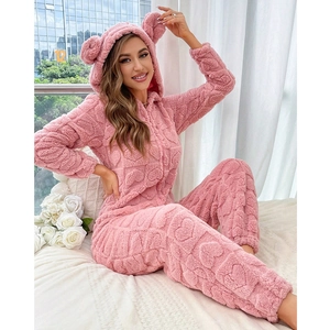 Pink heart-embossed fleece onesie for women with cute bear ears on the hood