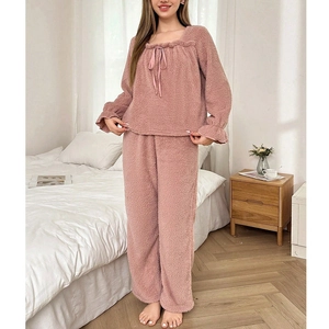 Thick pink coral fleece pajama set for women with square neck and lace-up bow detail
