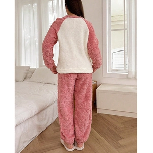 Women's warm fleece pajamas set with pink heart embossed pattern and raglan sleeves