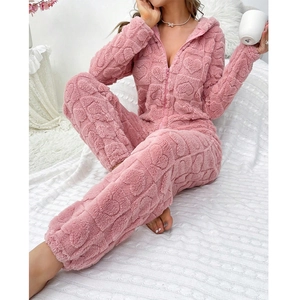 Pink heart-embossed fleece onesie pajamas with hood and front zipper for winter lounge