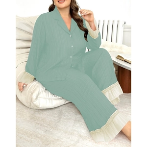 Detail of mint green pajama set featuring ruffled lace cuffs and ribbed texture fabric