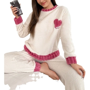 Women's cream coral fleece pajama set with pink heart embroidery and ruffled hem details