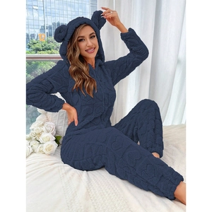 Detail of dark blue fleece onesie showing heart embossing and cute animal ear hood
