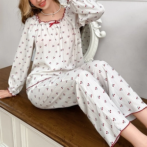 Women's two-piece cherry print pajama set with long sleeves and frilled edges