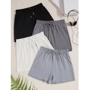 Detail view of casual drawstring shorts in four colors with comfortable elastic waistbands