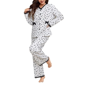 Quilted floral pajama set with lace trim and bow accents on white background