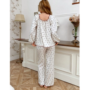 Sweet cherry floral pajama set for women with long sleeves and red ruffled trim details