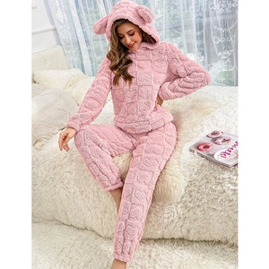 Pink fleece pajama set with heart pattern and cute animal ears on the hood
