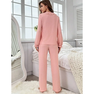 Pink waffle knit pajama set for women with ruffle collar and long pants back view