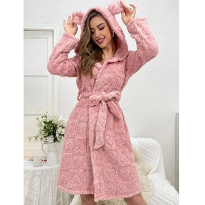 Detail of pink fleece bathrobe featuring cute bear ears on hood and heart jacquard pattern