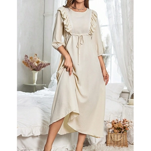 Detail showing apricot loungewear dress with ruffle trim and drawstring waist design
