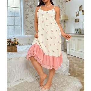 Close-up of floral print nightgown with soft pink ruffles and delicate fabric texture