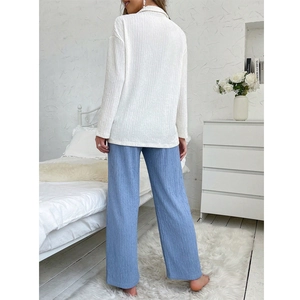 Women's pleated pajama set featuring a white lapel long sleeve top and blue trousers