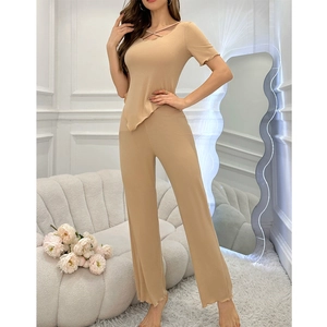 Detail of knit loungewear set with lace-up neckline and asymmetric wavy hem design