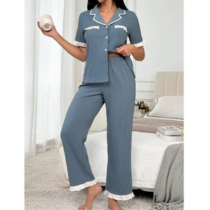Blue waffle knit pajama set for women with lapel collar and white ruffle trim detail