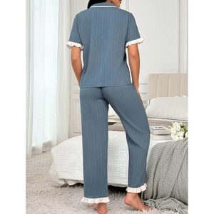 Women's pajama set featuring lapel cardigan and long pants with elegant lace trim
