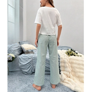 Women's V-neck pajama set with white short sleeve top and green striped wide leg pants