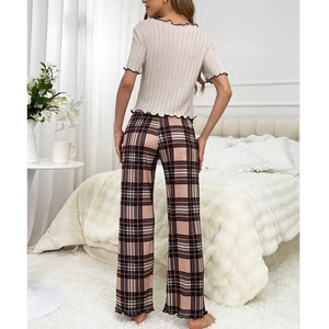 Women's pajama set featuring beige short sleeve top and pink plaid wide leg pants
