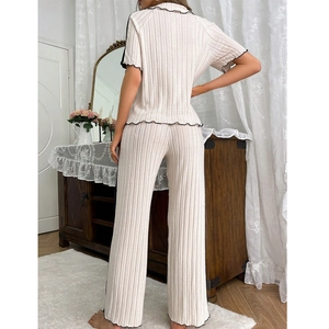 Women's lounge set with short sleeve top and ribbed pants featuring black lettuce trim