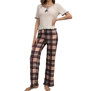 Women's pajama set featuring a short sleeve rib knit top and pink plaid trousers
