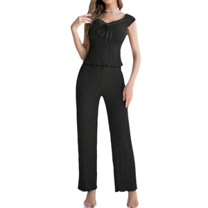 Women's black V-neck lace loungewear set with bow detail and textured wide-leg trousers