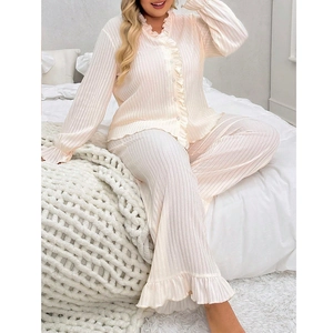 Women's V-neck pajama set with long sleeves, ruffle trim and ribbed knit texture in soft pink