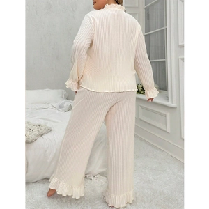 Women's plus size cream ribbed pajama set with elegant ruffled edges and V-neckline