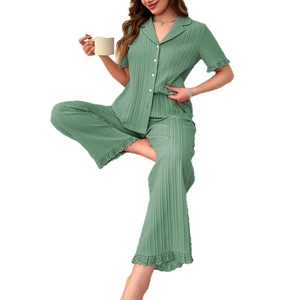 Women's green short sleeve pajama set with ruffle trim and vertical pleated texture