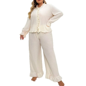 Women's plus size rib-knit pajama set featuring ruffled trim V-neck top and loose pants