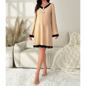 Detail of V-neck lace trim and ribbed knit texture on the long sleeve beige nightdress