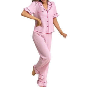 Pink waffle knit pajama set with short sleeves, lapel collar and ruffle hem long pants