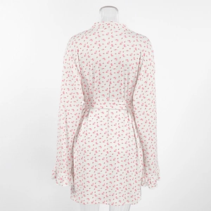 Detail of floral knit robe featuring ruffled cuffs and a matching tie-waist belt