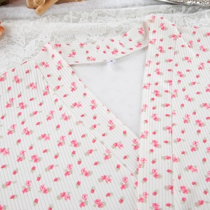 Detail shot of the floral print knitted robe showing the V-neck and size label S