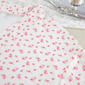 Detail of floral printed ribbed knit fabric and high-quality edge stitching on women's robe